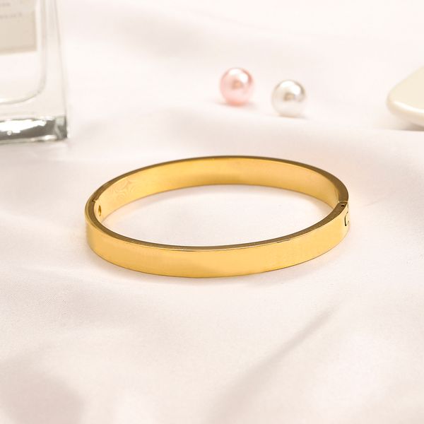1. Elegant gold-plated bangle for women, perfect as a stylish gift  
2. Luxury stainless steel bracelet with 18K gold plating, ideal for weddings  
3. Fashionable designer bangle for women, a premium jewelry piece  
4. Wholesale gold-plated bracelets, elegant gifts for special occasions  
5. Trendy stainless steel bangle with luxurious gold finish  
6. Chic wedding bracelet for women, crafted from premium materials  
7. High-quality gold-plated bangle, a sophisticated jewelry choice  
8. Stylish stainless steel bracelet, perfect for lovers' gifts  
9. Designer jewelry bangle with 18K gold plating, elegant and durable  
10. Fashion-forward women's bracelet, combining luxury and style
