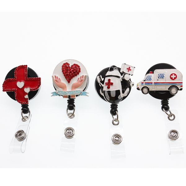 10-piece enamel rhinestone keyring set featuring ambulance, windmill, and stomach-shaped ID badge holders with alligator clips and retractable reels
