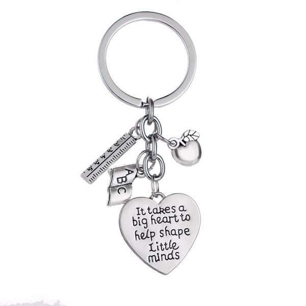 12-piece metal charm keyring set for teachers, featuring hearts, apples, rulers, and ABC letters to inspire young minds