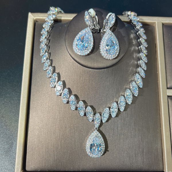 14K white gold bridal jewelry set featuring diamond earrings and necklace, a perfect engagement or wedding gift for women