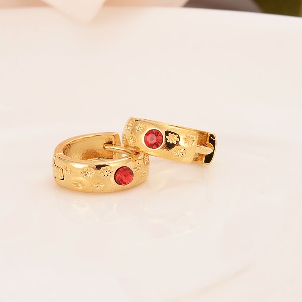 18k gold Huggies hoop earrings with red CZ for stylish and secure little girls