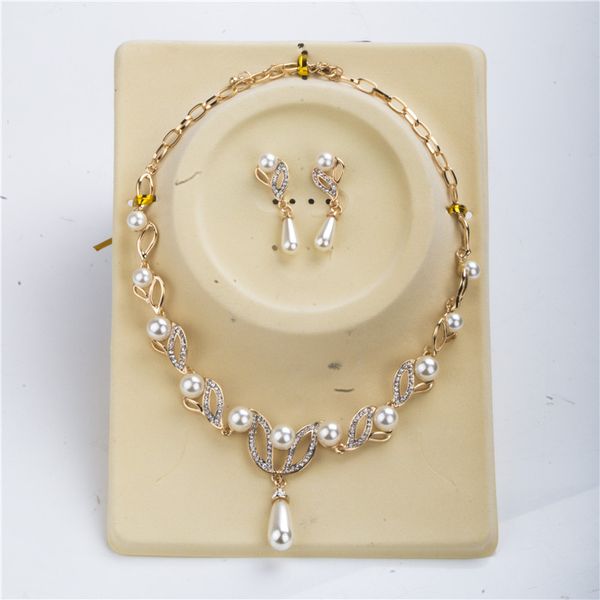 18k gold pearl necklace and earrings set with floral crystal pearl mosaic design, perfect for bridal and cocktail party jewelry