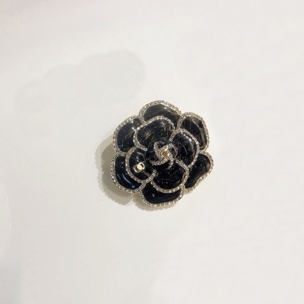 18k gold-plated designer brooches featuring elegant black floral patterns, perfect for women's fashion accessories at weddings and parties