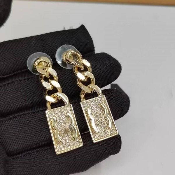 18K gold-plated designer earrings featuring C-letter studs, clip chain, and geometric designs with 925 silver and crystal rhinestones, perfect for weddings and parties
