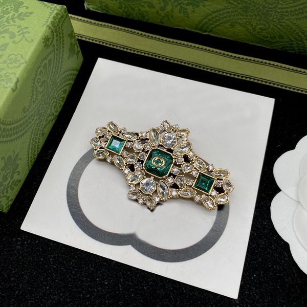 18K gold-plated emerald brooch with crystal rhinestones and pearl accents, perfect for weddings and parties