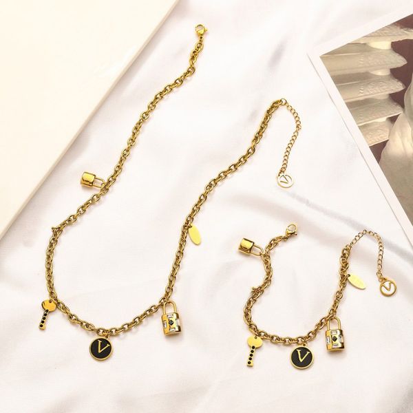 18k gold-plated pendant necklace featuring a luxury designer four-leaf love diamond letter lock, a stylish stainless steel women's fashion piece perfect for weddings