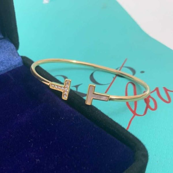 18K rose gold open band bracelet featuring double T and Fritillaria motifs with diamonds, a romantic Valentine's Day gift