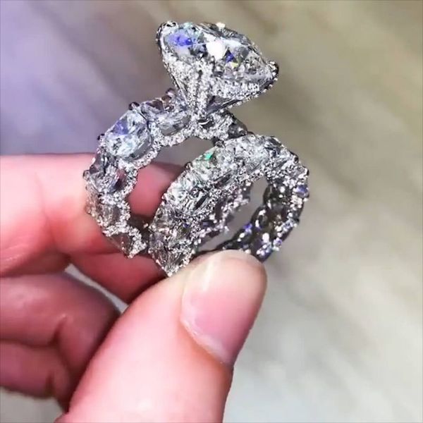 2020's top-selling luxury jewelry: elegant 925 sterling silver rings featuring large round-cut white topaz and CZ diamonds, perfect for weddings and bridal wear