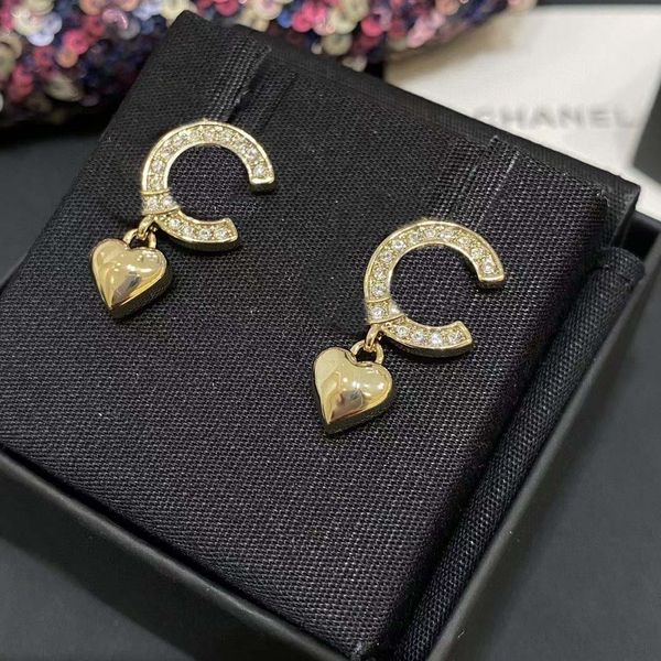 2023 luxury stud earrings featuring sparkling diamonds and a petite heart design in 18k gold plating, includes box stamped PS7351B