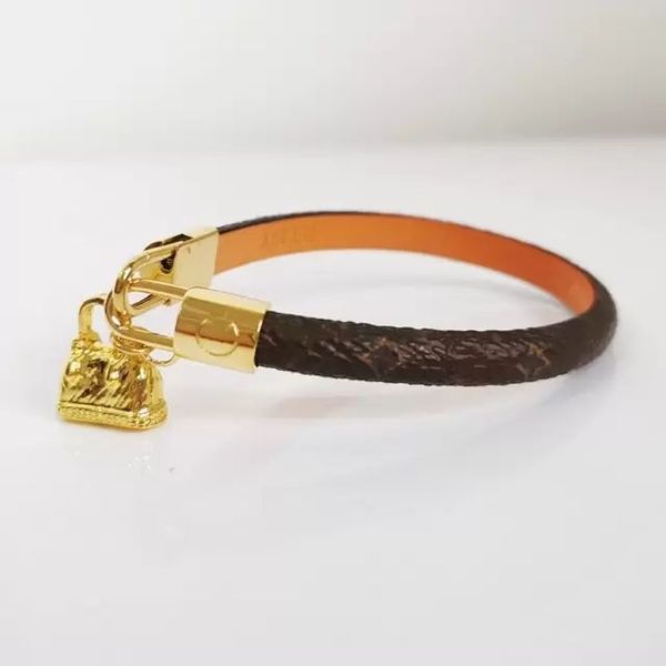 2023 stylish two-tone leather bracelet featuring a classic clover charm, a unisex luxury bangle with premium craftsmanship