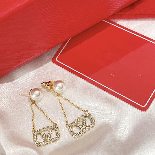 2023 stylish women's earrings featuring gold heart studs with pearl and crystal accents in 925 silver