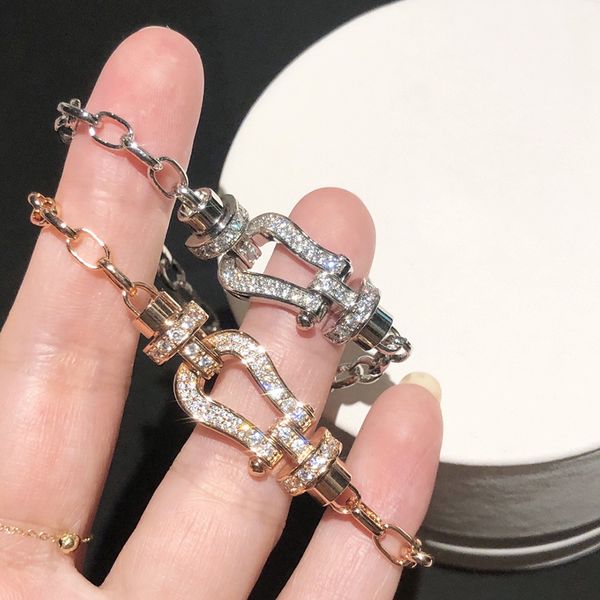 925 silver and 18k gold plated horseshoe bracelet with diamond accents in an 8-shaped buckle design for family
