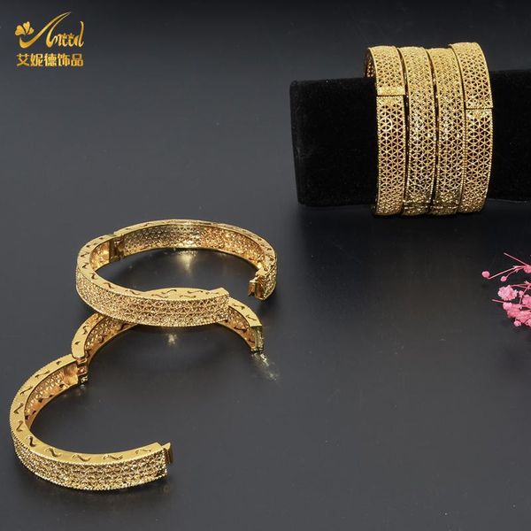 African-inspired gold-plated fashion bangles for women, stylish chunky designer bracelets available wholesale