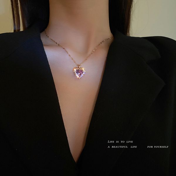 Amulet pendant necklace with titanium steel, diamond inlay, palace-style heart design, and feminine clavicle chain for elegant fashion