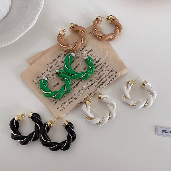 Black and white geometric circle hoop earrings in twisted leather and metal weave for women and girls, perfect for parties