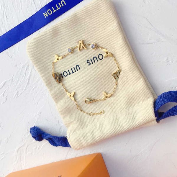 Bracelets for women featuring elegant bangle, wristband, and cuff designs with chain accents, stylish letter jewelry, and sparkling crystal embellishments in 18K gold-plated stainless steel, perfect for weddings and lovers