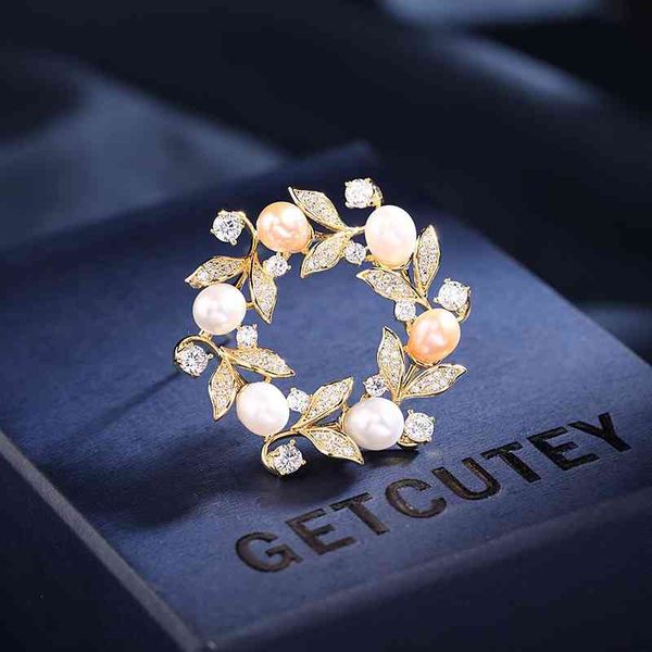 Brooch featuring high-quality freshwater pearls in a carambola branch wreath design, elegant and stylish for coat accessories
