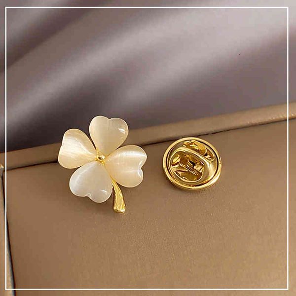 Brooch Korean Mini Love Cat's Eye Stone Clover High-grade Light Luxury Anti Buckle Pin Suit Small Incense

Rewritten:
Korean mini brooch with cat's eye stone clover, elegant anti-buckle pin for suits and small incense