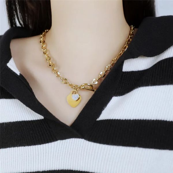 Chain Metal Fashion's elegant heart-shaped glass earrings paired with a 14K gold necklace set, stylish stainless steel jewelry for women from luxury brands