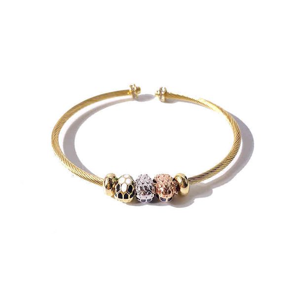 Charm bracelets featuring exotic snake head enamel designs with open round beads in a C-shape