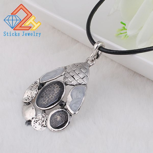 Charm necklace made from eco-friendly materials featuring a white pendant with an oil drop design at a budget-friendly price