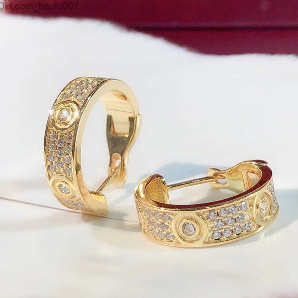 Charming rose gold plated sterling silver women's diamond stud earrings with crystal accents, a stylish 18K luxury jewelry piece
