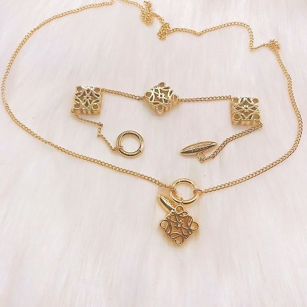 Chic 14k gold women's necklace featuring a stylish cube design, perfect as a long bracelet or elegant wedding and sweater accessory