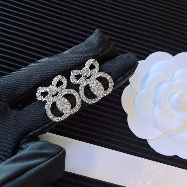 Chic designer earrings featuring bowknot designs with sparkling rhinestones for stylish women's fashion jewelry