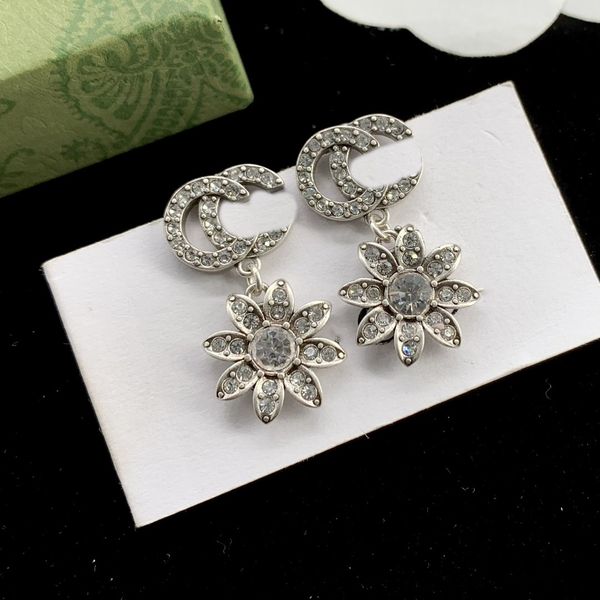 Chic double-letter charm earrings featuring an embossed stamp design, perfect for women's parties and anniversaries, come with a gift box  

Elegant dangler stud earrings with double-letter charms ...
