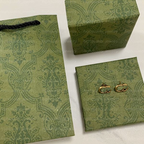 Chic double-letter charm earrings featuring embossed stamp studs and dangler design, elegantly presented in a gift box, perfect for women's parties and anniversaries