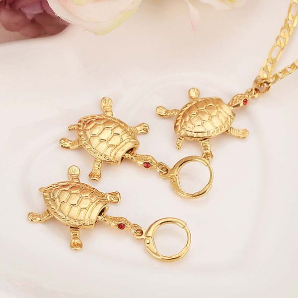 Classic 18k gold pendant earrings with tortoise shell design, red CZ stones, and Figaro chain for women's elegant party jewelry