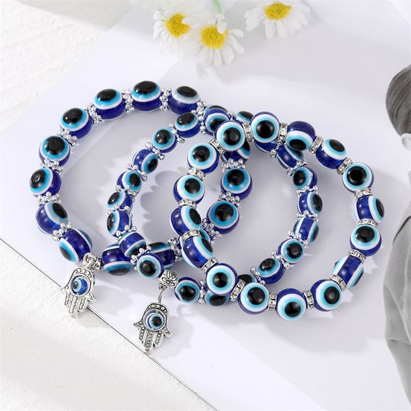 Classic blue evil eye charm bracelet with elastic rope and resin beads, a stylish jewelry gift for women