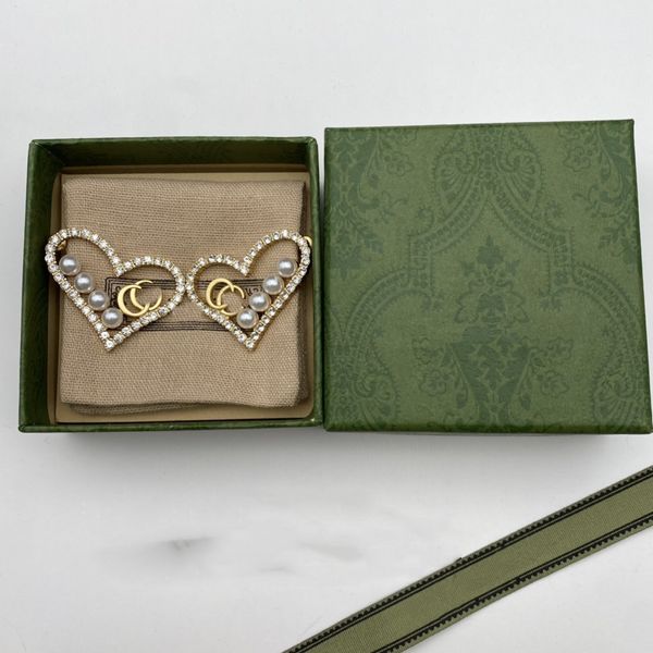 Classic earring designer crafts stylish gold letter studs for women, perfect for parties, weddings, and gifting