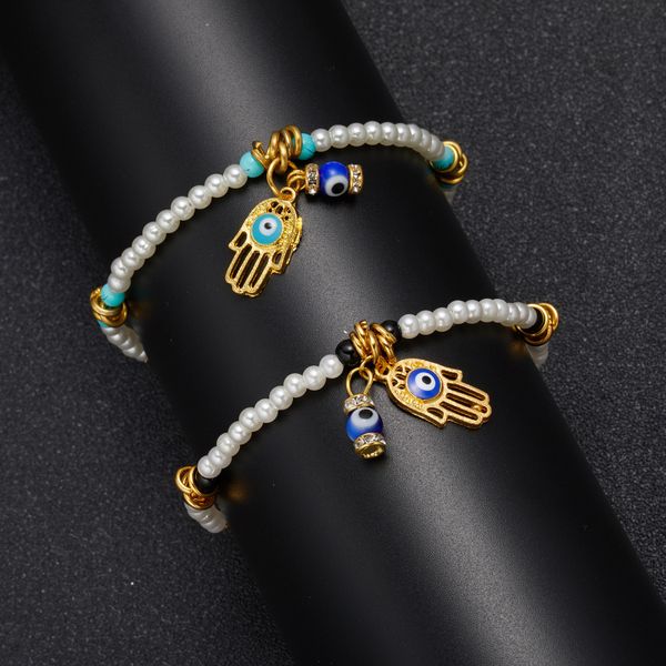 Colorful handmade Bohemian seed bead bracelet featuring an evil eye Fatima hand charm, available for wholesale