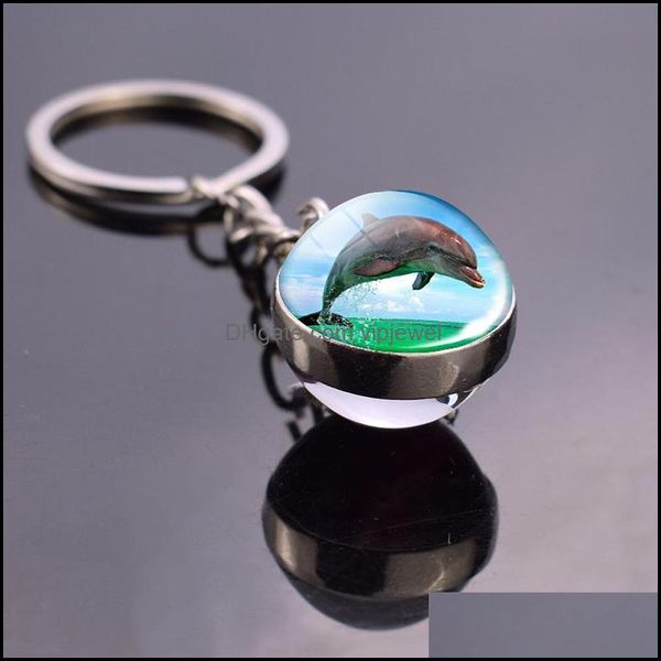 Custom sea animal keychains featuring turtles, starfish, sharks, jellyfish, and dolphins with double-sided glass pendant designs