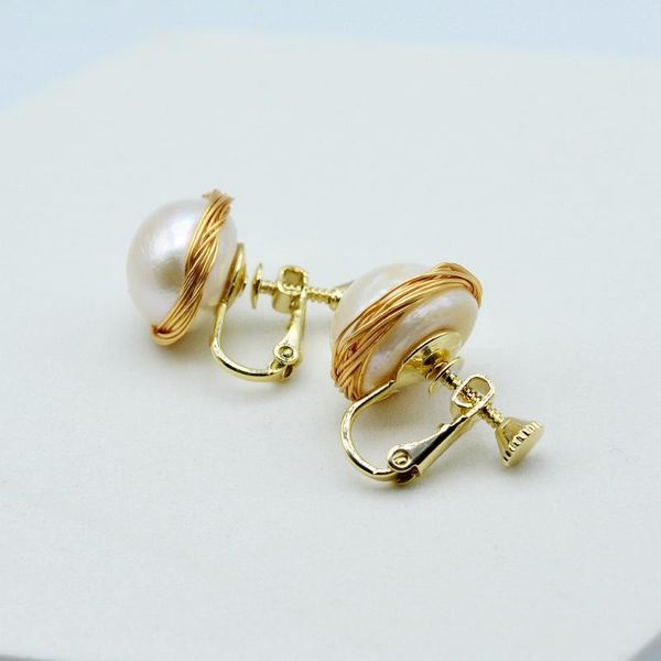 Dangle & Chandelier Women's Pearl Ear Clips, Handmade, Natural Baroque Pearls, Golden Pierced Earrings, Jewelry

Handmade women's pearl ear clips featuring natural baroque pearls with golden pierce...