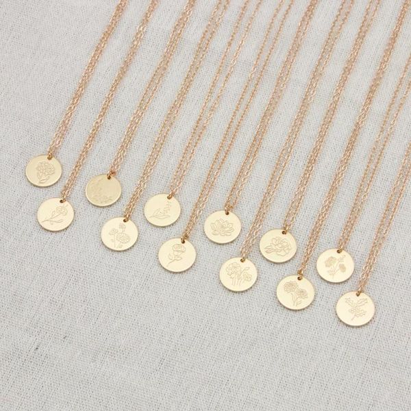 Delicate pendant necklaces featuring birth flower carnation charms, layered with flower month disc designs, perfect as a jewelry gift for mothers and women, available in 15mm size and 18-inch length