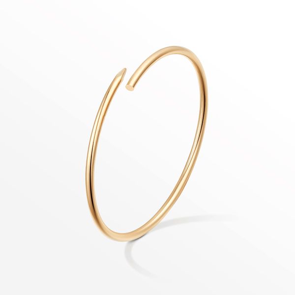 Designer bracelets featuring slim nail bangles for women and men, crafted from 316L titanium steel with cubic zirconia accents