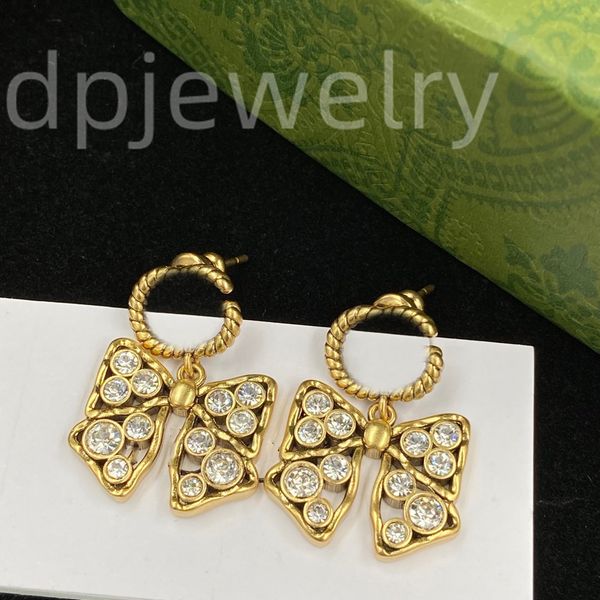 Designer double-letter earrings in 18K gold, a charming gift box with embossed details perfect for women's parties and anniversaries