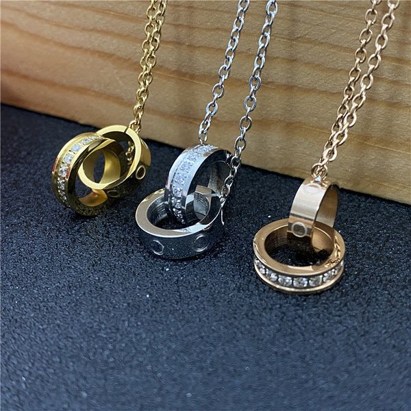 Designer fashion jewelry featuring pearl necklaces, custom pendants, and gold/silver double rings with diamond love charms for Valentine's Day gifts