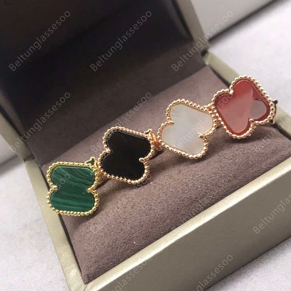 Designer four-leaf clover earrings in gold-plated medium size, elegant classic style for women and men, featuring a luxurious yet subtle stud design