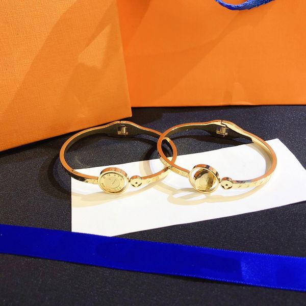 Designer reversible bangle bracelet in stainless steel, a stylish European-American fashion accessory perfect as a wedding or love gift for women