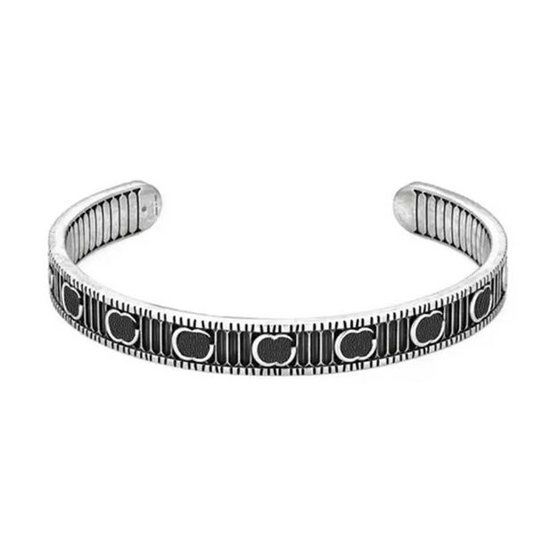 Designer silver bangle bracelet for women featuring double-sided carved patterns in blue, a stylish unisex fashion accessory