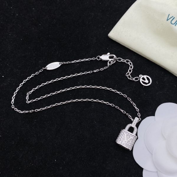 Designer silver shamrock pendant necklace set for women, ideal as boutique jewelry for parties, weddings, or gifting to daughters