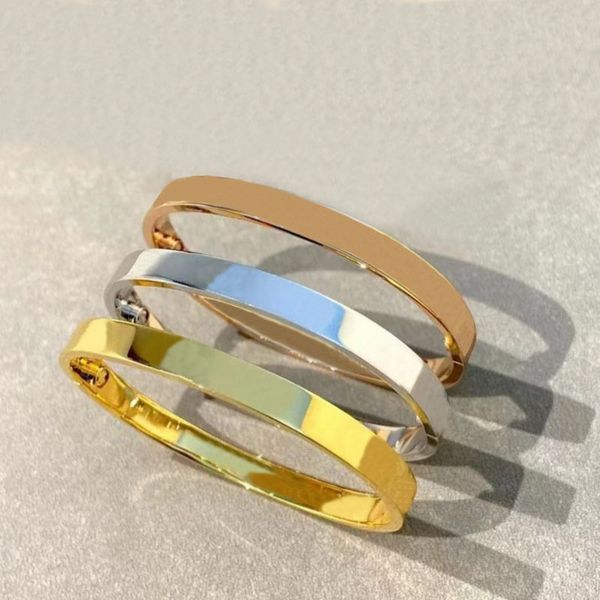 Designer titanium bangles and luxury bracelets in silver, rose gold, and stainless steel for women and men, featuring screwdriver couple jewelry