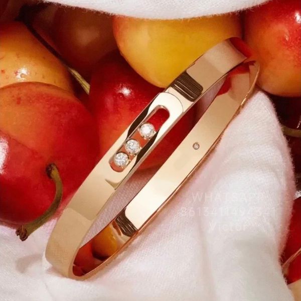 Designer women's bangle bracelet with 18K gold plating, featuring premium diamond crystals for lasting elegance and style
