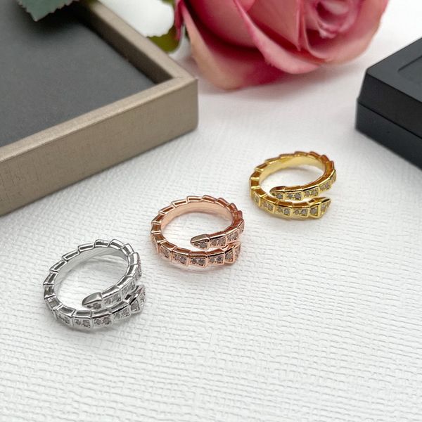 Designer women's narrow ring featuring a single circle with inlaid zircon diamonds in gold-plated snake serpent shape, size US6