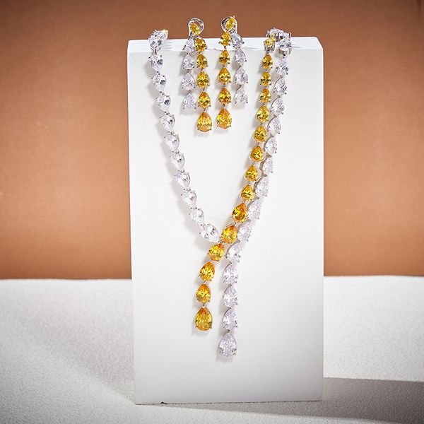 Designer-style women's necklace and earrings set featuring pear-shaped yellow cubic zirconia in gold-plated tassel double chains