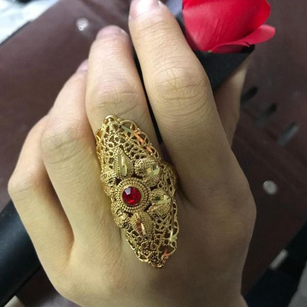 Dubai gold cluster rings with red stones for women, African Ethiopian jewelry popular in Arab, Indian, Nigerian and Middle Eastern weddings