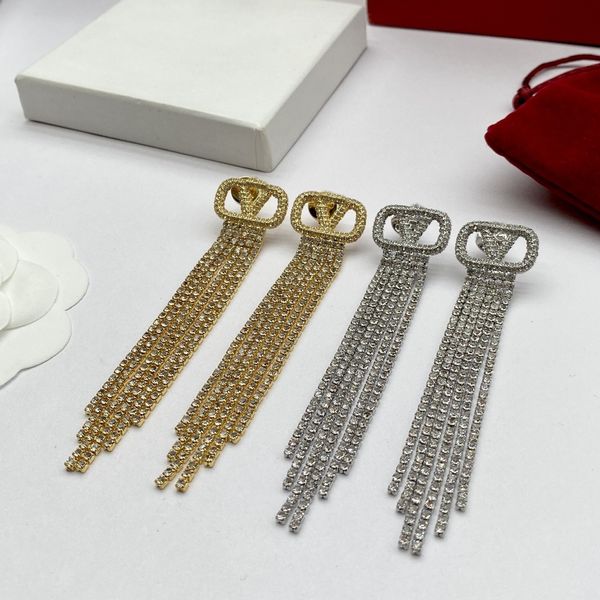 Earring designers craft elegant gold heart-shaped pearl and crystal jewelry with a double V design for women